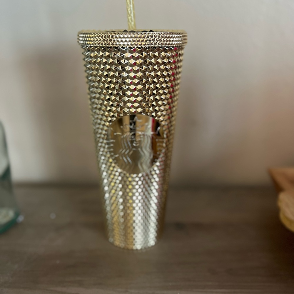 Gold studded Starbucks cup